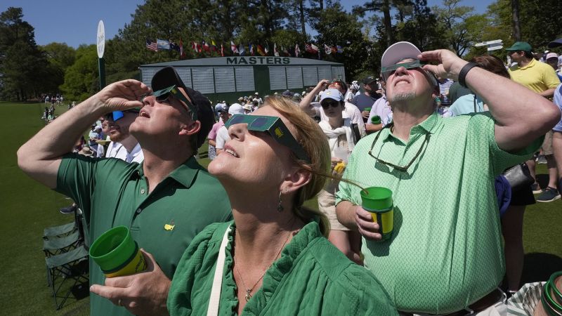 Eclipse Craze Hits The Masters: Darkness, Drama, and Souvenir Shades!